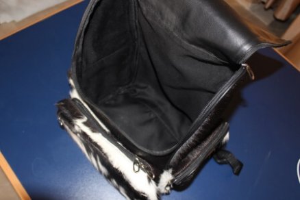 Cowhide rucksack lined interior open slit pockets