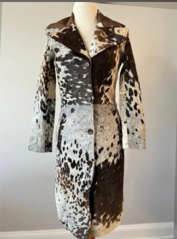 Horn-style button and notched lapel detail on cowhide coat