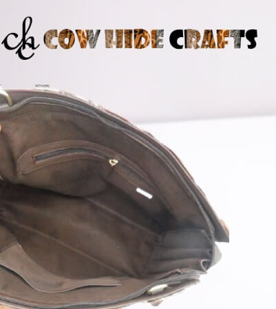 Cowhide crossbody bag lined interior zipper pockets