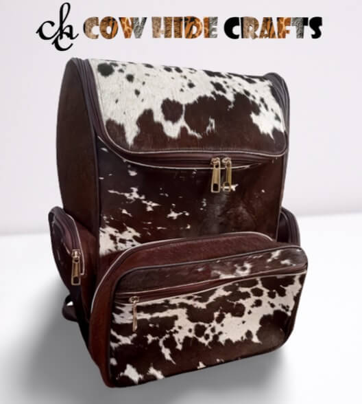 Brown and white cowhide diaper backpack with leather straps