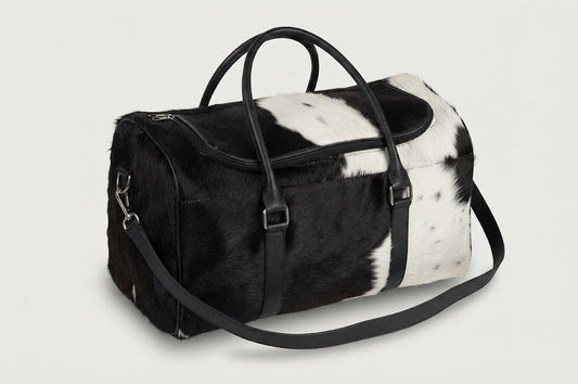 Exterior end slip pocket detail on cowhide duffle bag