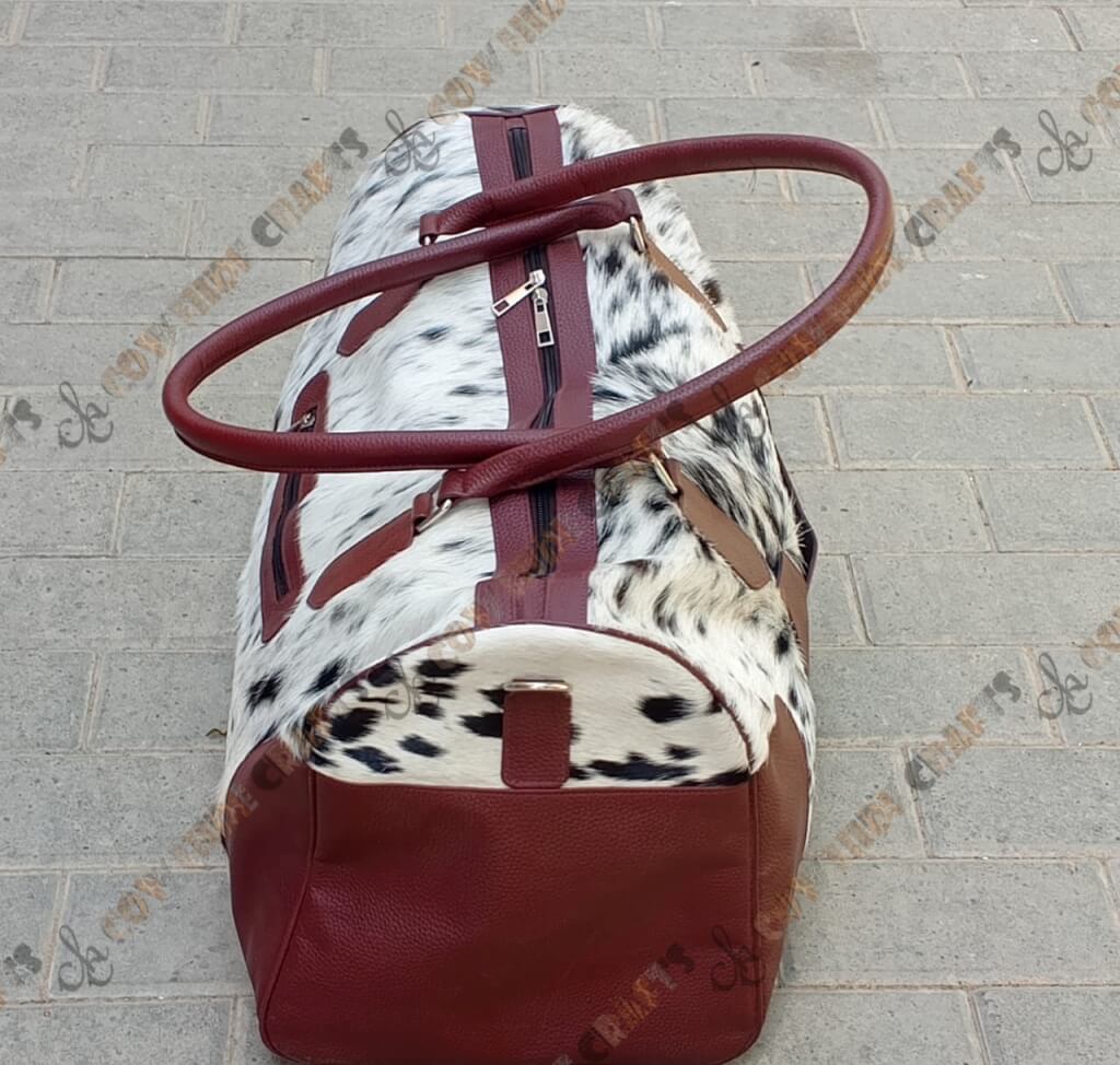 Hair on cowhide maroon travel duffle
