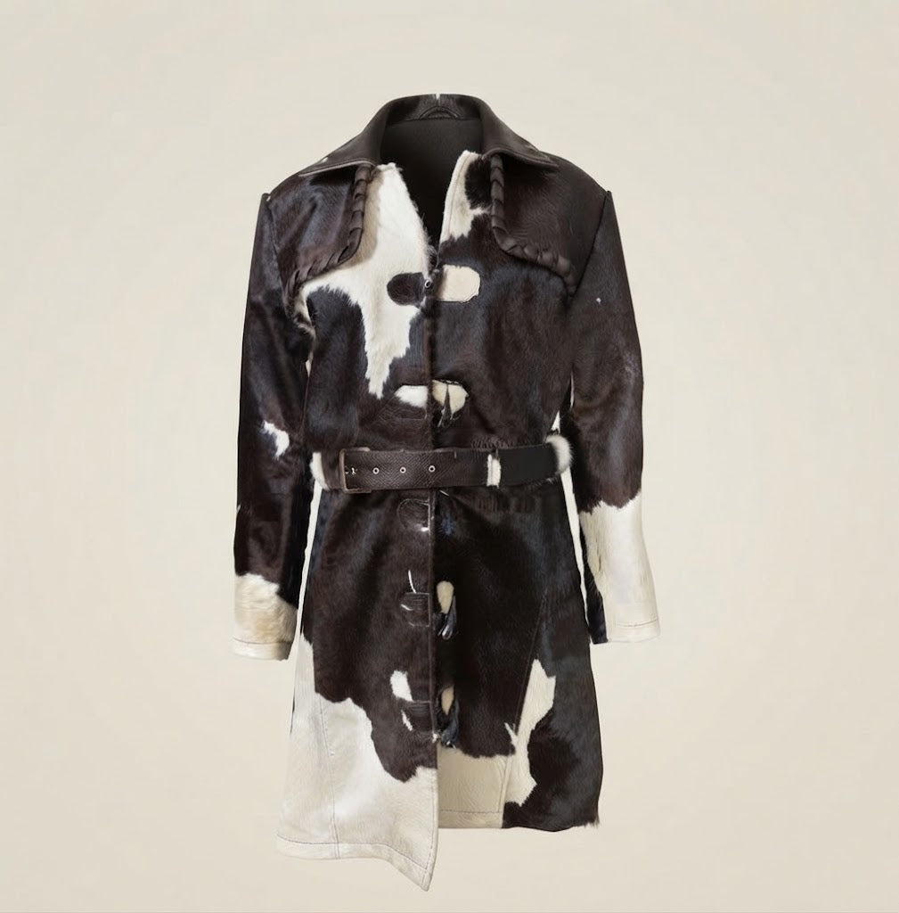 Adjustable belt buckle detail on black and white cowhide coat