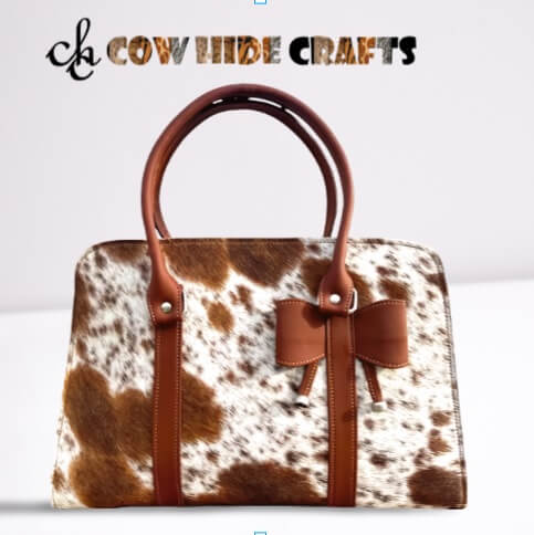 Cowhide purse with bow tan white