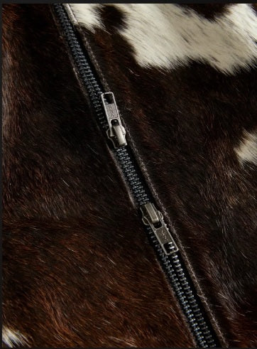 Dual gunmetal zipper hem detail on cowhide mini skirt