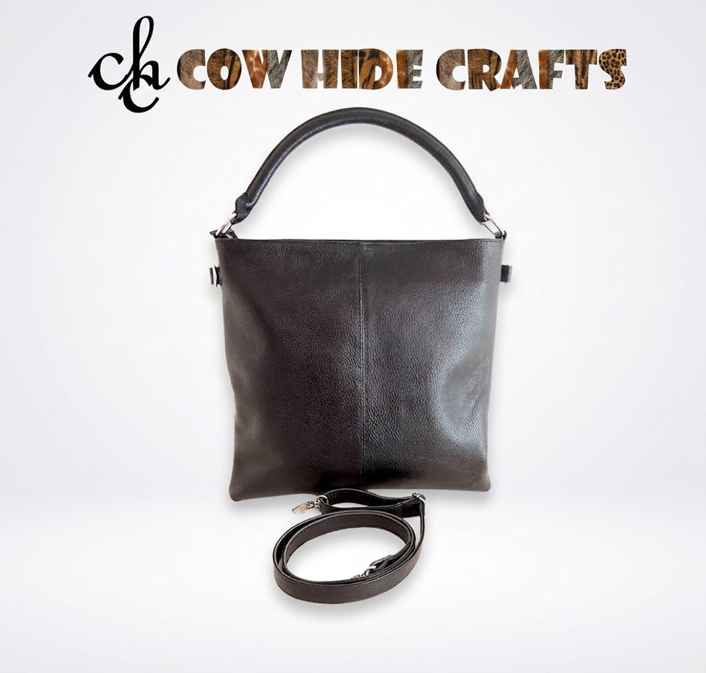 Smooth black leather back panel on hair-on cowhide tote bag