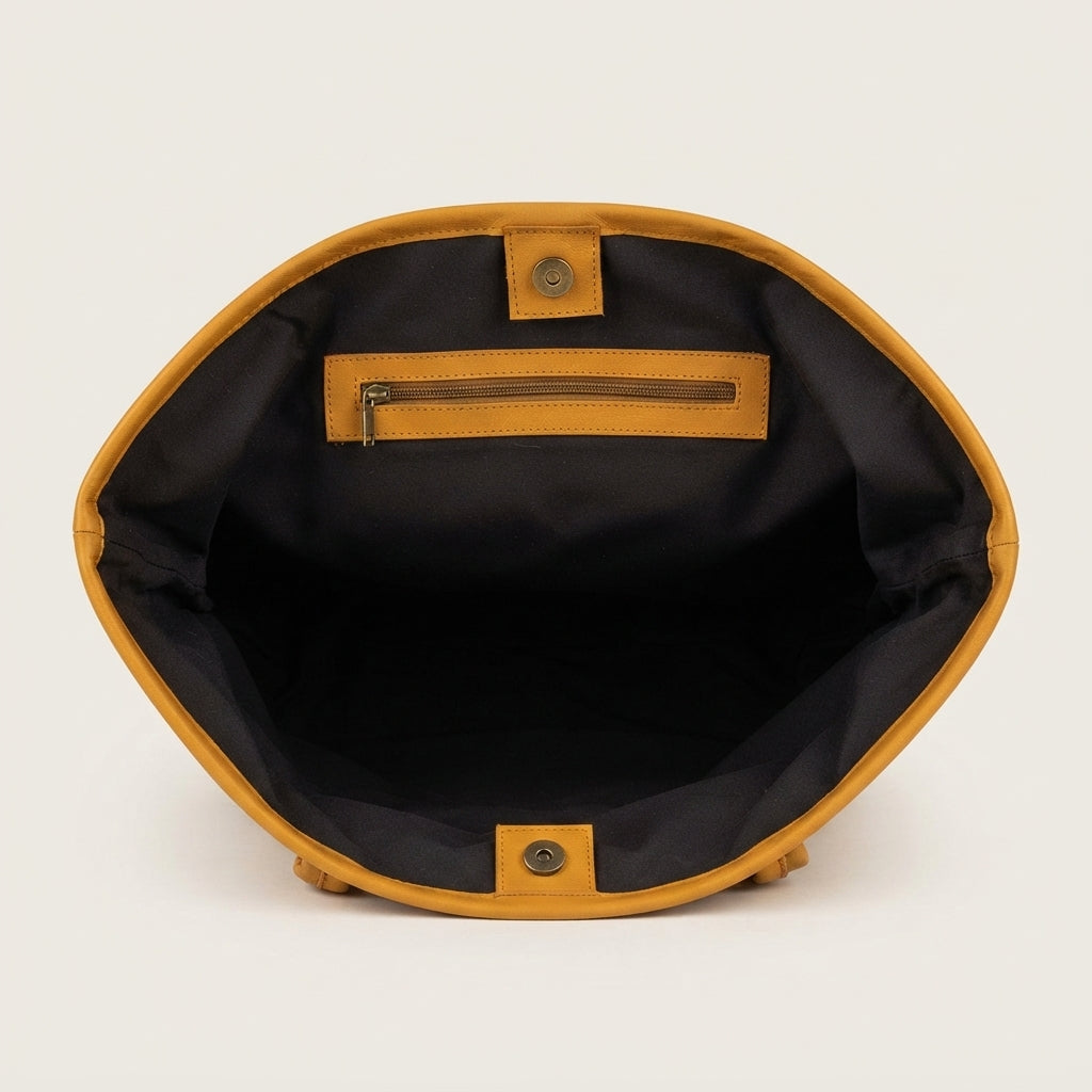 Fully lined interior with zipper pocket inside cowhide tote bag