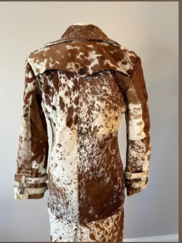 Storm shield flap detail across cowhide trench coat back