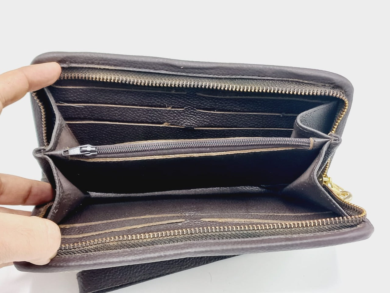 Interior card slot panels inside cowhide patchwork wallet