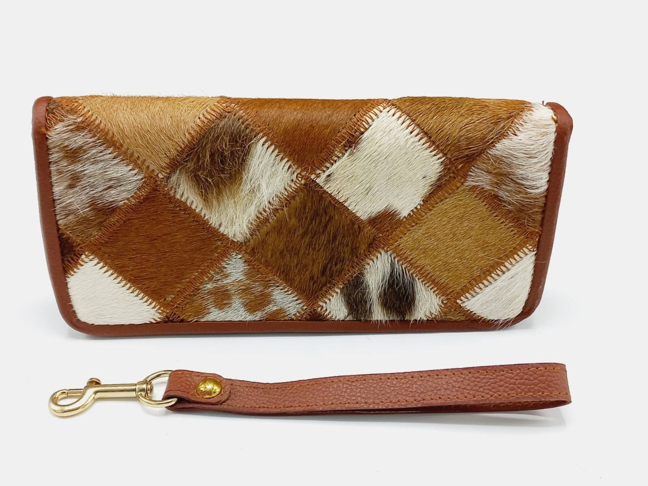Detachable wristlet strap with brass swivel clasp on cowhide wallet