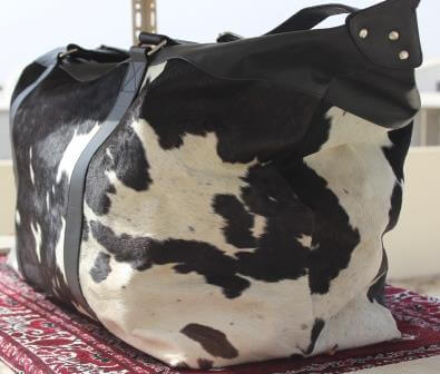 black white cowhide weekender bag