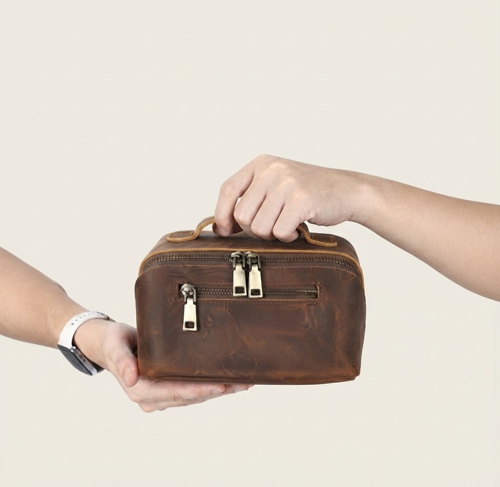 Front zip pocket with antiqued brass pull on crazy horse dopp kit