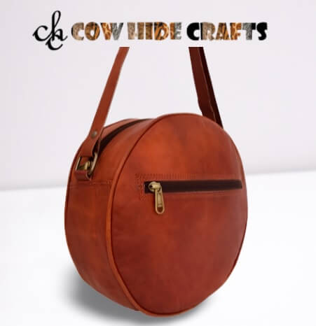 Tan Leather crossbody hiking purse.