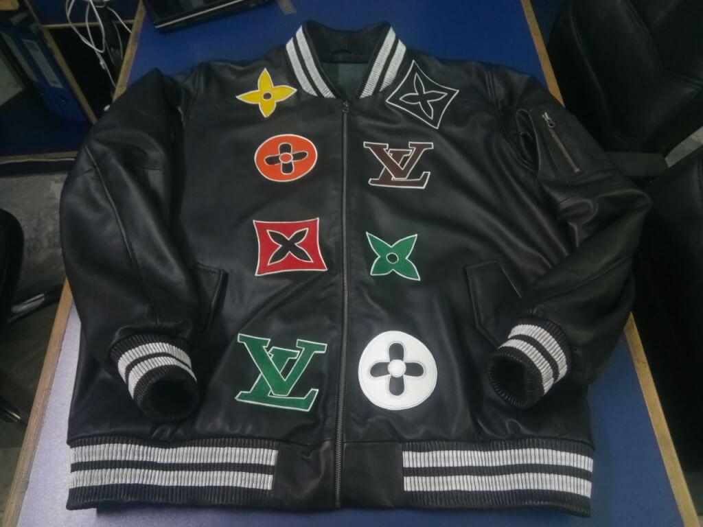 Designer print leather jacket with front panel branding