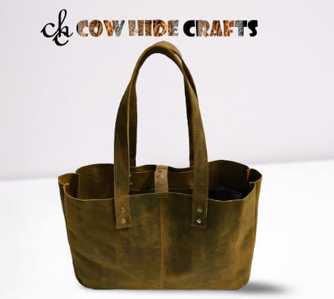 Dual shoulder handles on raw style vintage leather bucket bag