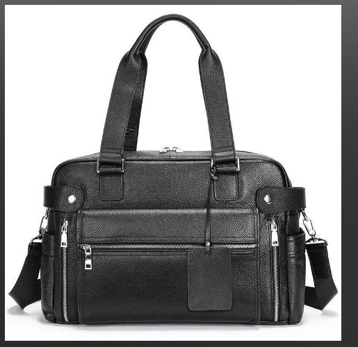 Front zip pocket detail on pebbled leather executive briefcase