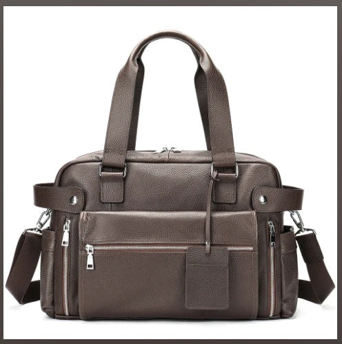 Detachable shoulder strap detail on pebbled leather briefcase