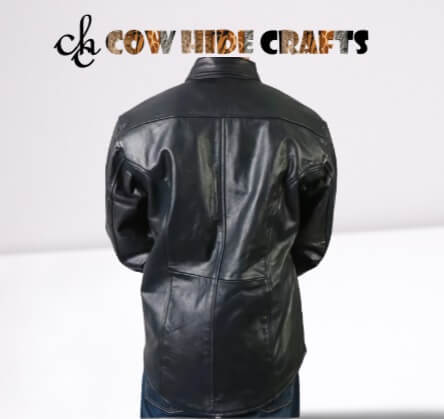 Extended hem detail on long black leather shirt 