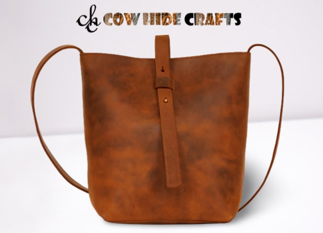 Flap closure on women's vintage distressed leather crossbody