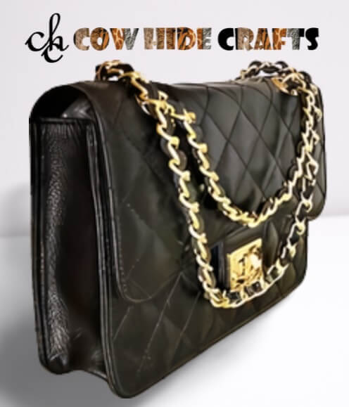 Flap and toggle closure on black quilted leather clutch bag