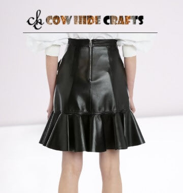 Black leather skirt with backside zipper and flowing hem detail