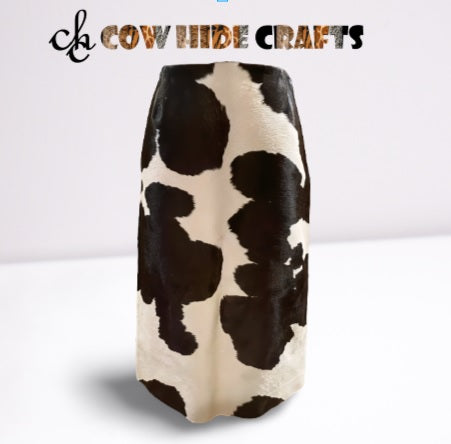 Close-up of dark brown and white hair-on cowhide pattern on midi skirt