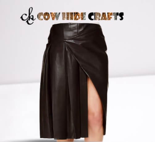 Half-open pleated panel detail on black sheepskin leather skirt