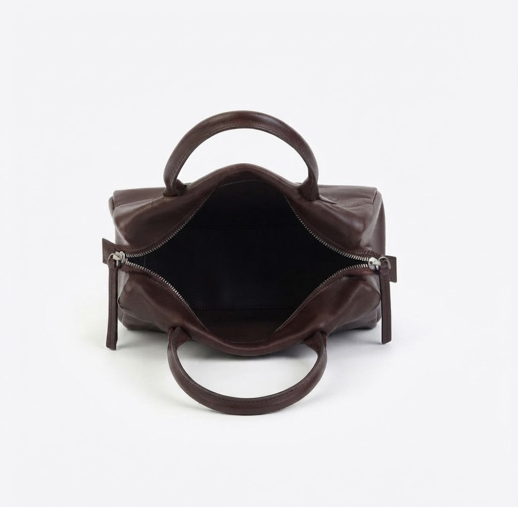 Inside lined with zipper pocket and open pockets