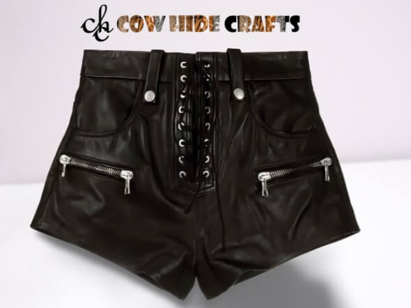 Close-up of lace-up eyelet closure on black sheepskin shorts