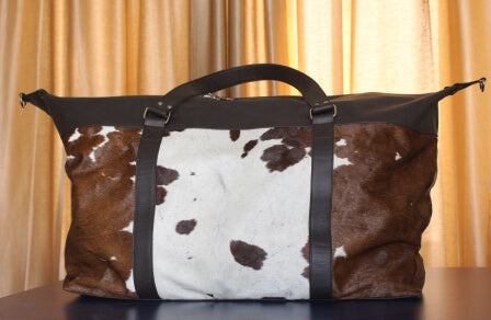 large cowhide travel duffle bag brown white