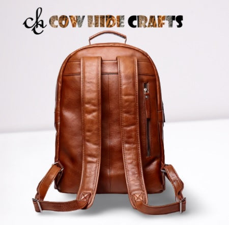 Leather backpack rounded top handle reinforced stitching