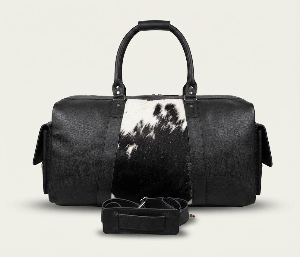 Detachable shoulder strap detail on leather cowhide duffle bag