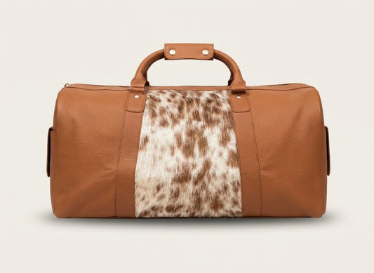 Leather duffle bag with cowhide panel in tan cognac colorway