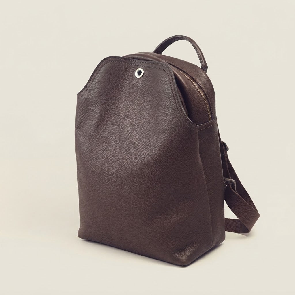 Leather flap backpack with turn-lock closure in dark brown