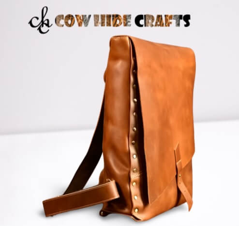 Flap closure studded leather backpack 