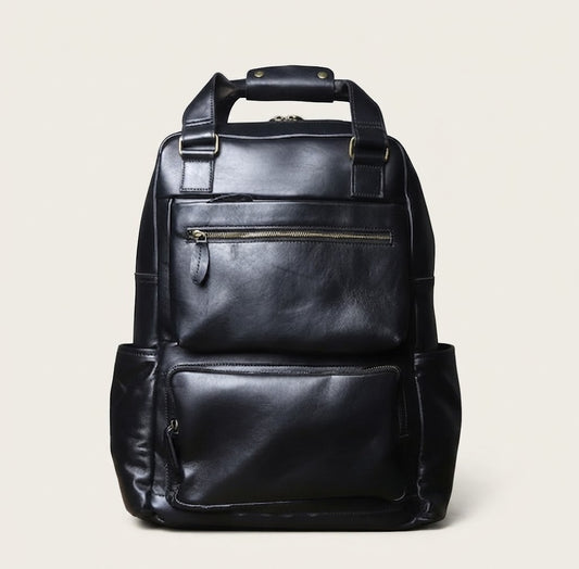 Leather travel backpack in black colorway front view