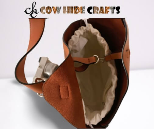 Lined interior of tan leather basket style bucket handbag