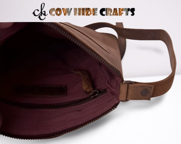 Lined interior with zipper pocket in vintage brown leather bag