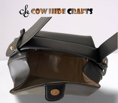 Lined interior with zipper pocket in mini black leather purse