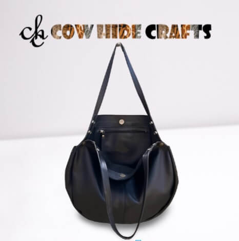 Magnetic closure and dual handles on black leather hobo bag