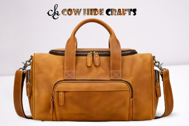 Main zipper and 3 outside pockets on tan leather duffle