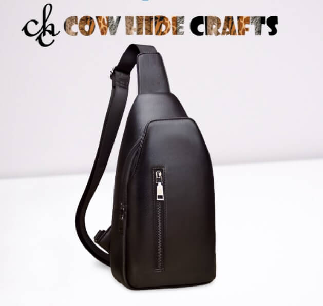 Main zipper and front pockets on black leather sling bag