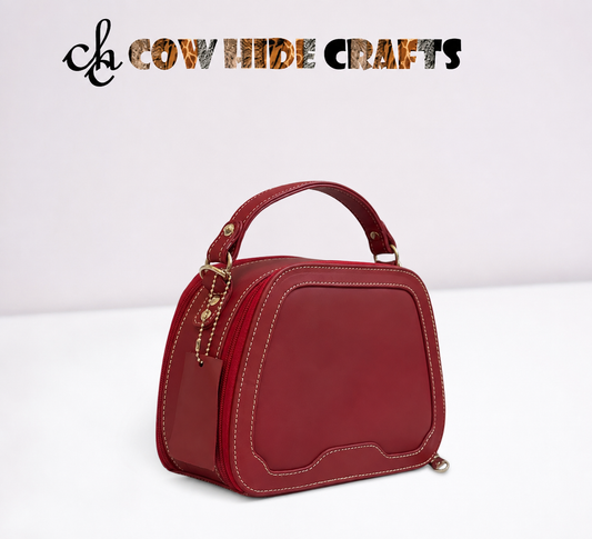 Maroon leather bag curved top dual zipper structured