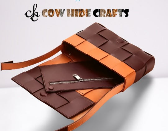 Matching leather clutch included with two-tone patchwork bag