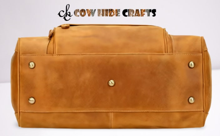 Metal base feet on premium tan leather travel duffle bag