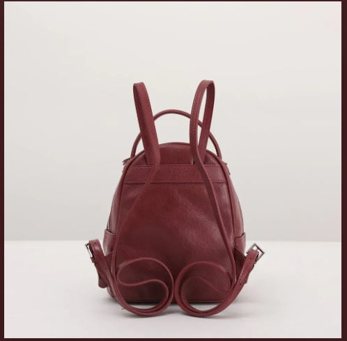 Adjustable shoulder strap detail on leather mini daypack