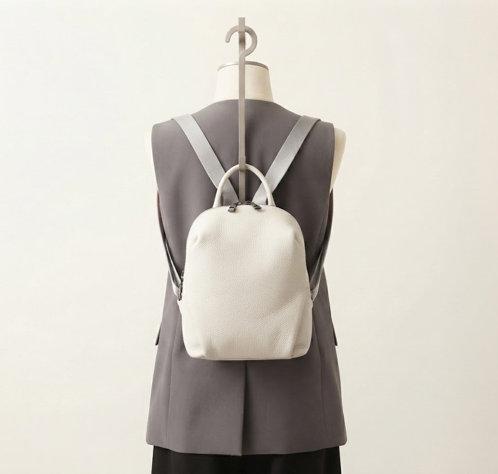 Mini leather conversion backpack in white colorway