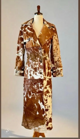 Buttoned gun flap detail on cowhide trench coat chest