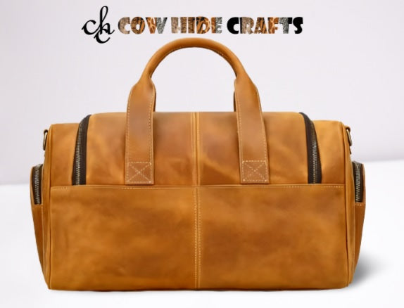 Oil pull-up leather texture detail on tan travel duffle bag