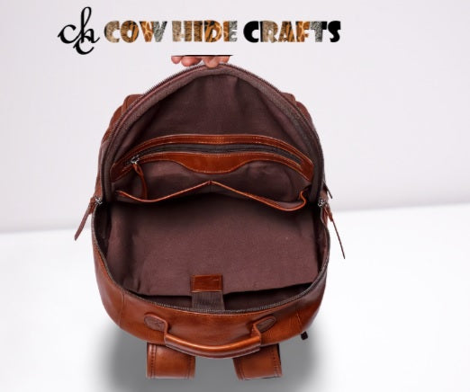 Pebbled leather backpack integrated inside lined with zipper pocket and laptop sleeves